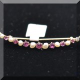 J021. 14K yellow gold with amethyst and pearl curved bar pin - $85